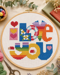 Bordado colorido em ponto cruz com corações, arco-íris, figuras e mensagem I love you colorido
